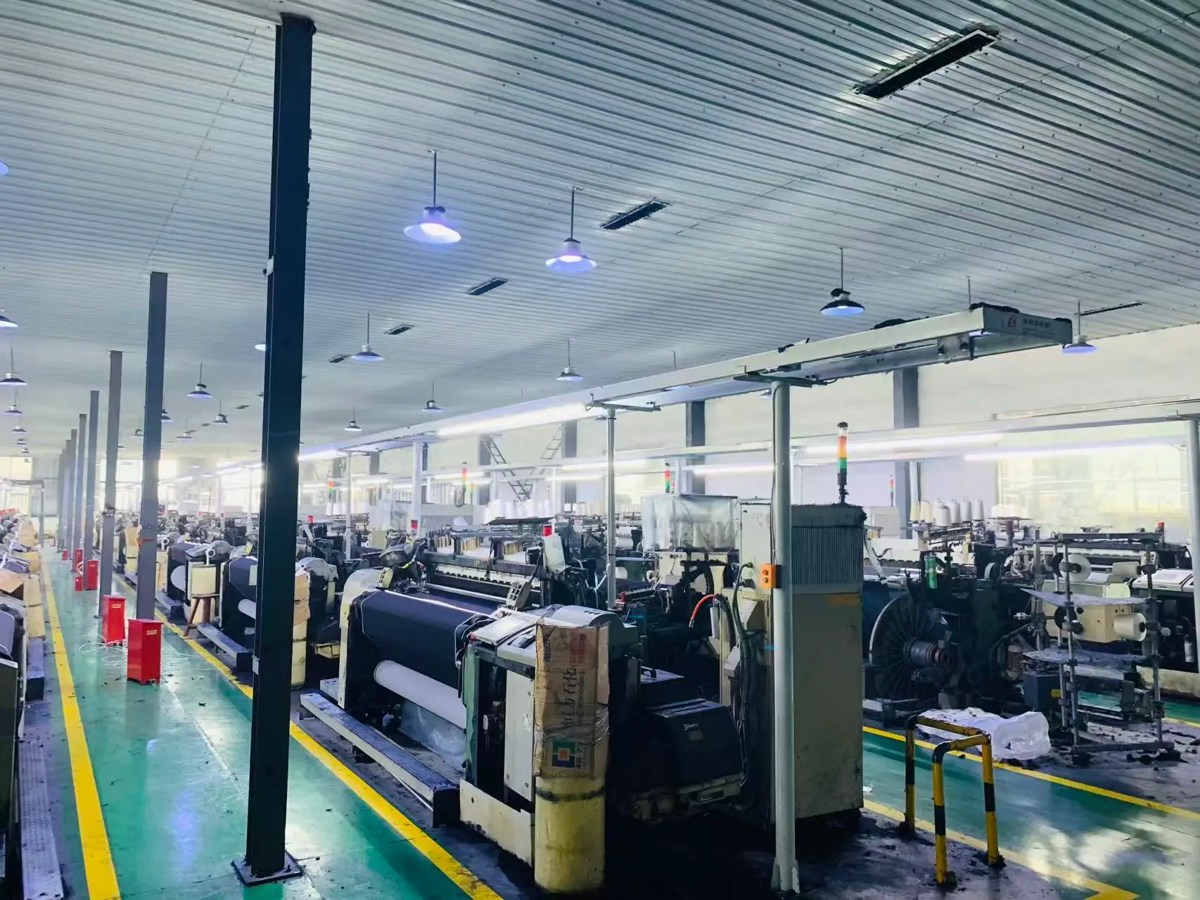 Aisle between weaving machines